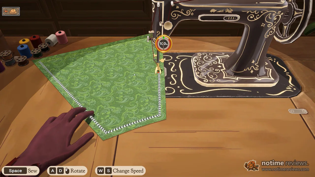 Dressmaker: green brocade fabric feeding through the sewing machine