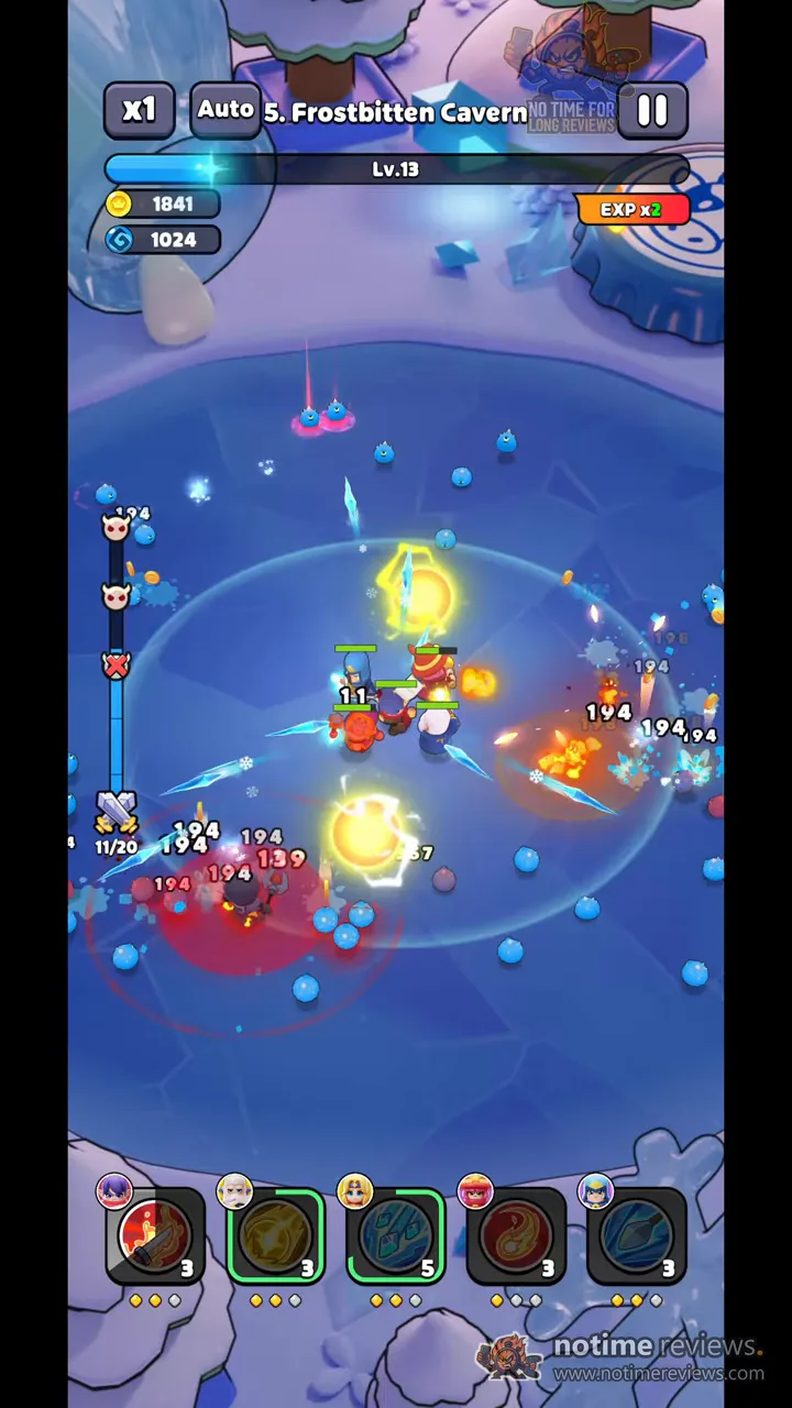 Wittle Defender: heroes fighting a wave of blue slimes in the Frostbitten Cavern with damage numbers scattered across the ice